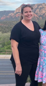 a woman standing next to a woman
