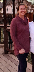 a woman standing next to a man